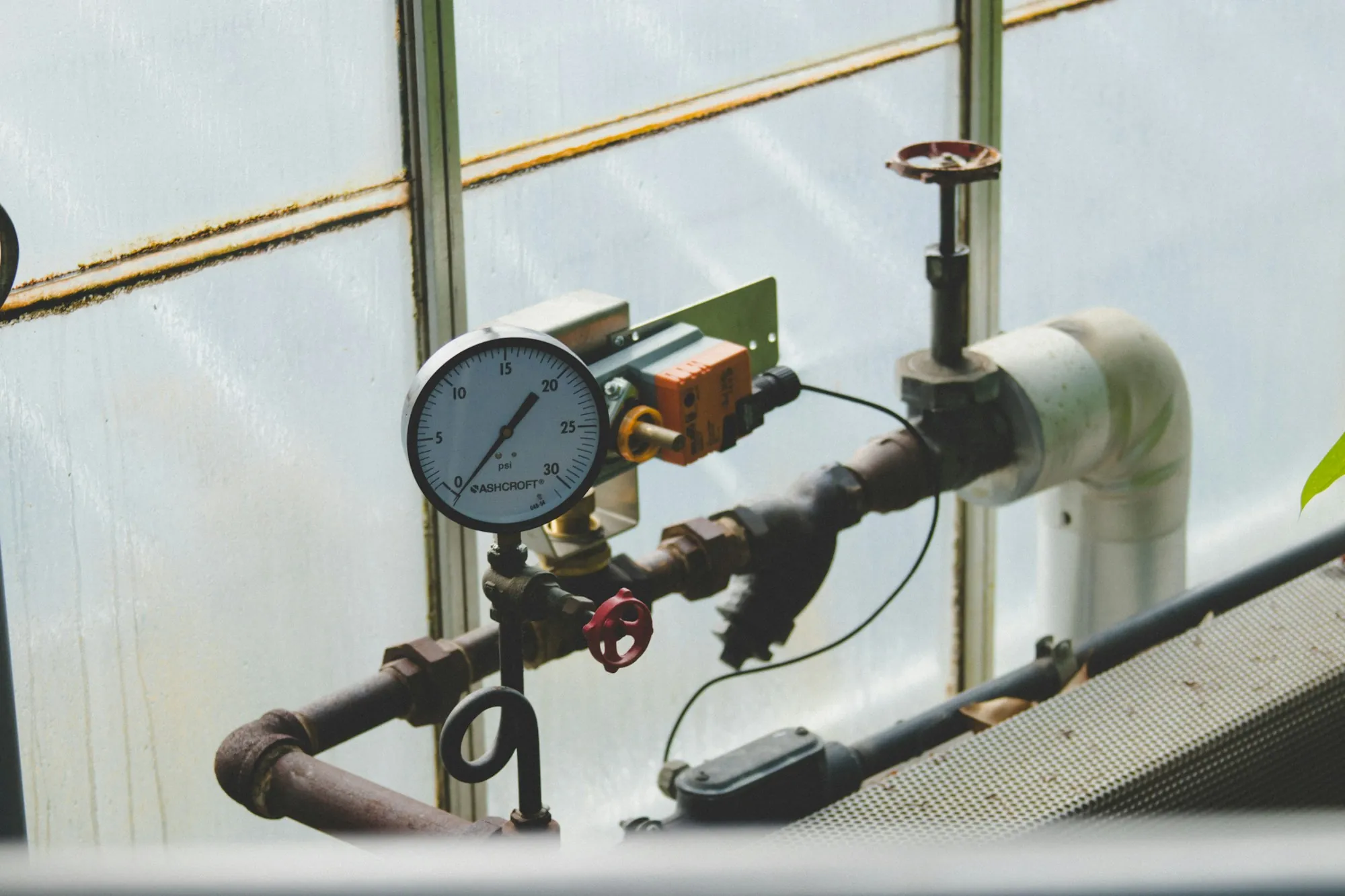 Pressure gauge on a pipe in a utility space